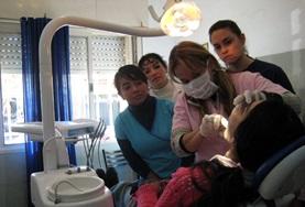 Volunteer Medical Electives Dentist inspecting the teeth and gums of a patient