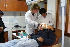 Volunteer Medical Electives A Medicine Elective volunteer inspects a patient on a placement in Peru