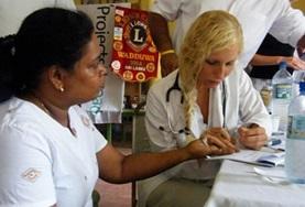Volunteer Medical Electives A Nursing Elective intern prepares to do a healthcare screening on a local child in Sri Lanka.
