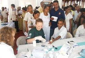 Volunteer Medical Electives An intern doing her Physiotherapy Elective in Sri Lanka observes as a local physiotherapist demonstrates a treatment technique.