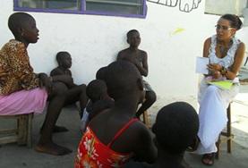Volunteer Togo A Human Rights volunteer speaks to local people in Togo about their rights during an awareness campaign.