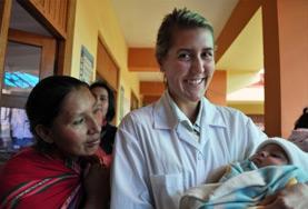 Volunteer Medicine & Healthcare A Midwifery volunteer poses with a newborn at a placement in Peru