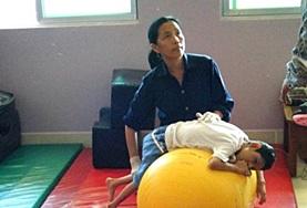 Volunteer Medicine & Healthcare A volunteer on a Physiotherapy Project in Cambodia works with a patient during a session