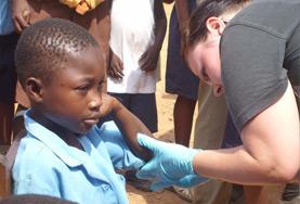 Volunteer Nursing A Nursing volunteer checks a child's heart rate as part of her Medical internship abroad.