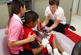 Volunteer Occupational Therapy An Occupational Therapy volunteer works closely with a local child to improve his daily functioning during her Medical internship.