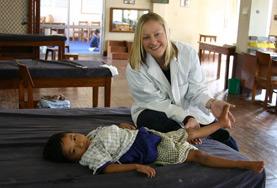 Volunteer Physiotherapy A Physiotherapy volunteer does light stretches with a boy at a care centre as part of our Medical internship in Tanzania.