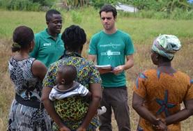 Volunteer Micro-finance Volunteers talk to locals on a Micro-finance Project in Ghana