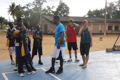 Volunteer Sports Basketball coaches and players talk on a court