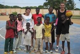Volunteer Sports Volunteer and children pose for a picture at a placement in Ghana