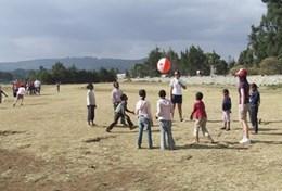 Volunteer Sports Athletes warm up before a practice session with a volunteer